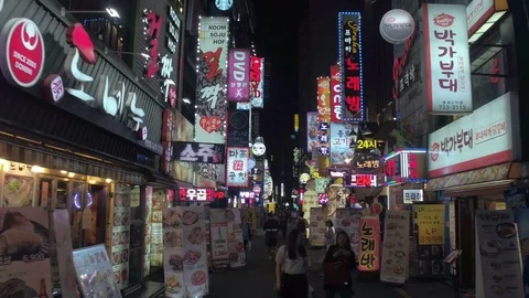 Video shot of Myeongdong Shopping Street at night in Seoul Stock Footage