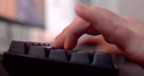 The video showcases closeups of hands using technology pressing a keyboard butto Stock-Footage 297200985