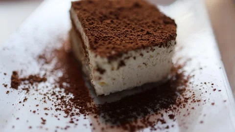 The video showcases a delectable souffle cake adorned with a luscious Stock-Footage 266983409