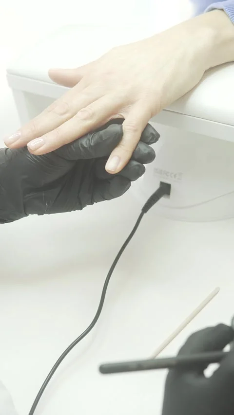 The video showcases a nail technician creating stunning designs Stock Footage 305648596