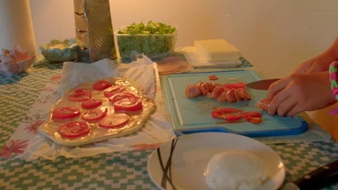 A video showcases pizza prep, skillfully slicing fresh veggies Stock Footage 318927373
