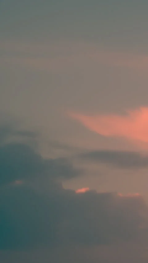 The video showcases a soft, diffused sky with a predominantly pink hue. Video stock 279923426