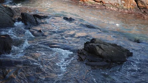 A video showcases waters dynamic relationship with rocky landscapes Stock-Footage 282791921