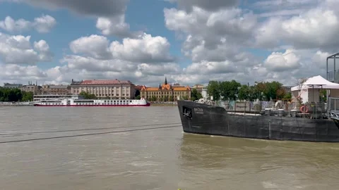A video showcasing a serene riverside view with Bratislava Castle Stock Footage 303712894