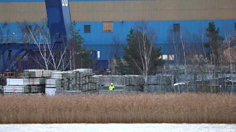 Video showing the construction of a large ship at sea, filmed from a distance. Stock Footage 322092617