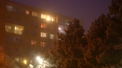 This video shows a captivating night scene of a building with illuminated window Stock Footage 297200044