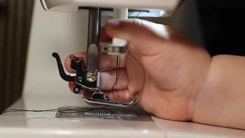 The video shows a close up of a child hand playing with a needle Stock Footage 276445148