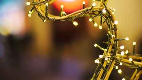 The video shows a close-up of warm, glowing Christmas lights.  Stock-Footage 322530642