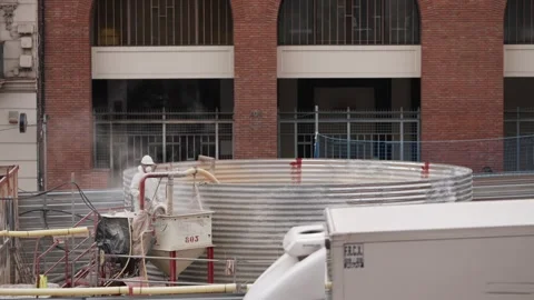 Video shows a construction site with workers and large machinery Stock Footage 295419449
