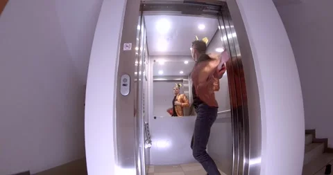A video shows diverse personalities in an elevator with unique stories Stock Footage 313564340
