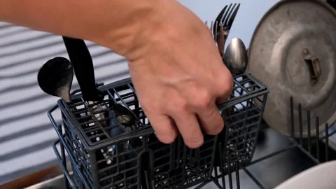 Video shows efficient dishwasher loading, optimizing space and ease Stock Footage 293226252