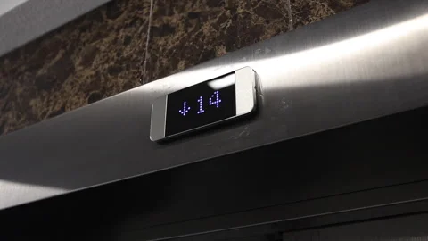 This video shows an elevator traveling to the 14th floor Stock Footage 307932339