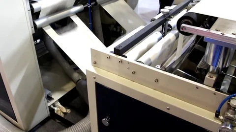 The video shows a factory producing plastic bags. Stock Footage 129874844