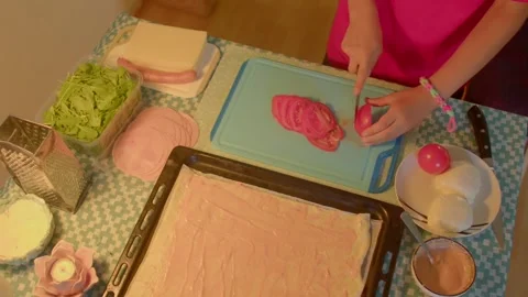 A video shows individuals skillfully preparing food and slicing meat Stock-Footage 318847550