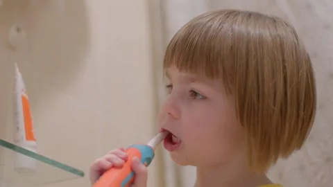The video shows kids practicing hygiene, brushing teeth, and selfcare Stock Footage 313432575