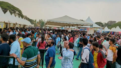 A video shows a large crowd gathered in line to sample mango products at th.. Stock Footage 290078558