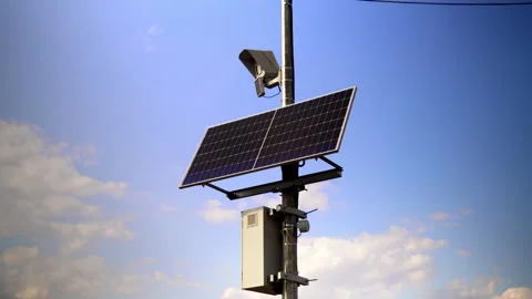This video shows solar panels installed on a pole in the city to power Stock Footage 240579831
