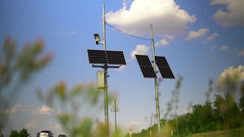 This video shows solar panels installed on a pole in the city to power Stock Footage 240580351