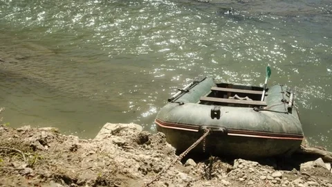 Video shows a tranquil river and lake with various boats, evoking peace Stock Footage 313935904