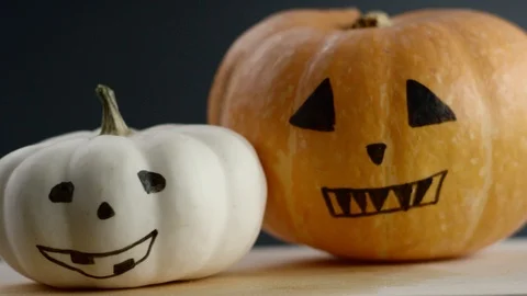 Video shows two painted pumpkins, black background Stock Footage 108561905