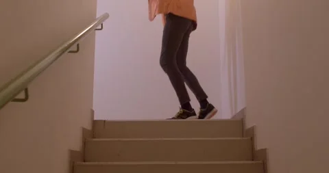 A video shows various individuals interacting with stairs, capturing movement Stock Footage 313564468