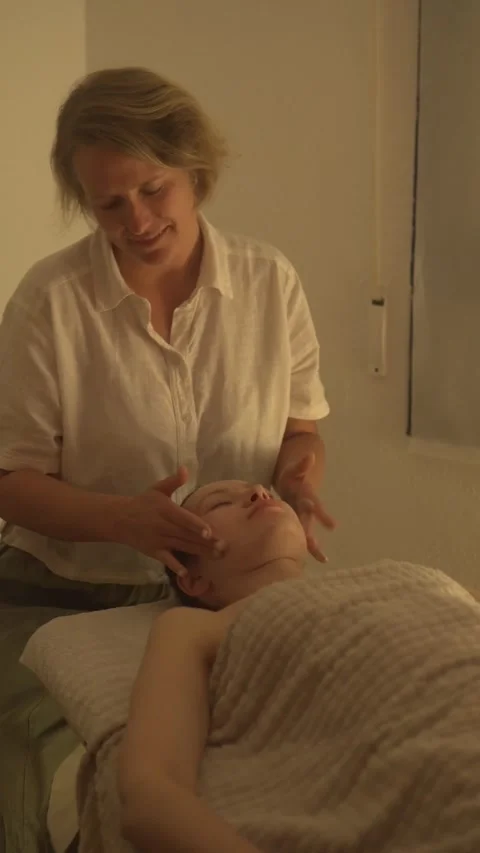 Video shows women using calming massage techniques in serene settings Stock Footage 307620249