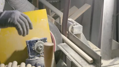 The video shows a woodworking process, where a spinning machine smooths Stock-Footage 296247806