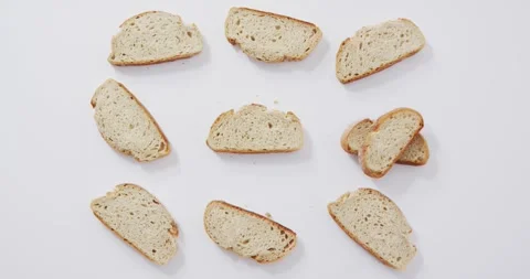 Video of slices of bread seeing from above on white background Stock Footage 335198162