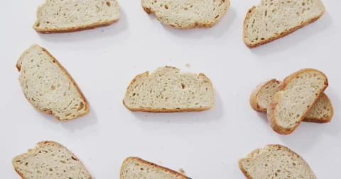 Video of slices of bread seeing from above on white background Stock Footage 339412527