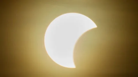 Video slideshow of a Solar eclipse over the landscape, showing dark lunar s.. Video stock 342539647