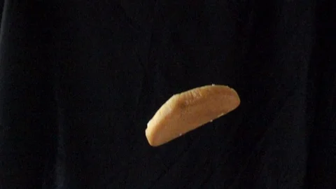 Video slow motion The bread fell from the top on black background, 스톡 동영상 111991478