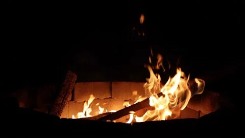 This is a video of slow motion flames from a backyard firepit. Stock Footage 153453029