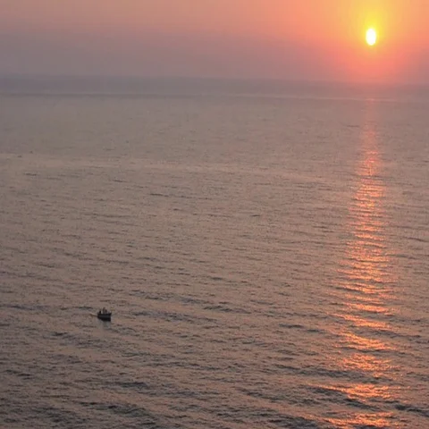 Video of small boat at sunset Stock Footage 69291633