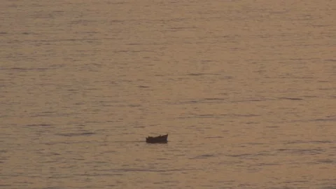 Video of the small boat in the waves of the sea (Pacific Ocean in Lima, Peru) Stock Footage 236273774