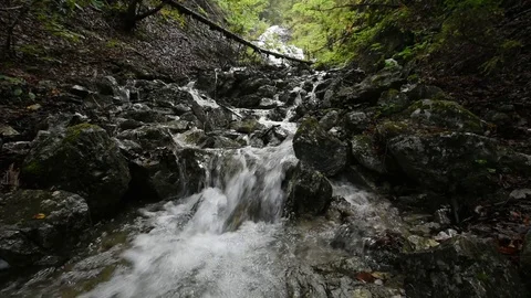 Video of a small mountain waterfall Stock Footage 79900339