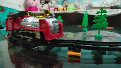 Video of small train toy in motion. Colorful train toy running Stock Footage 340309300