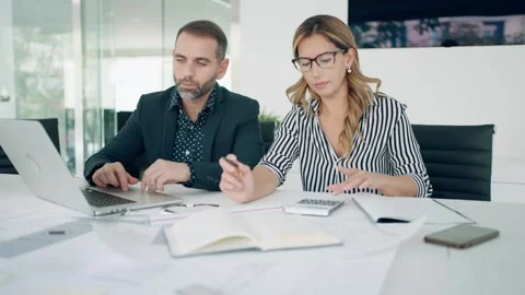 Video of smart architects working with plans while talking of their new des.. Stock Footage 242143291