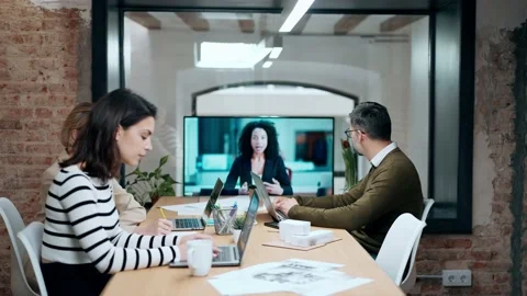 Video of smart business people working and talking of they new project whil.. Video stock 240082553