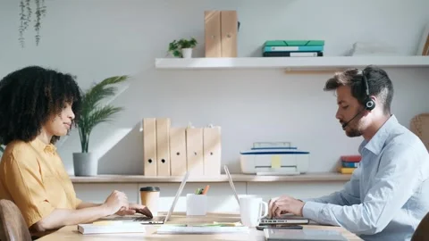 Video of smart business team doing a video calls while talking with earphon.. Stock Footage 294604059