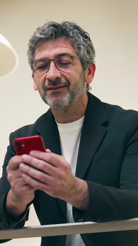 Video of smart businessman using smartphone in an elegant office Stock Footage 340829194