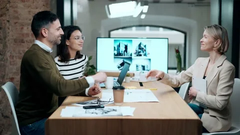 Video of smart group of architects working with laptops and blueprints whil.. Stock Footage 240082580