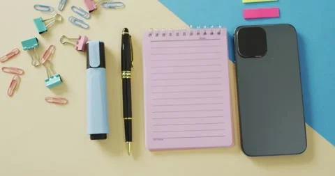 Video of smartphone, notebook with copy space and school equipment on yellow Stock Footage 331245666