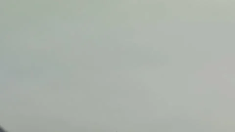 Video of a smashed, destroyed, light blue, retro car figurine left in the mid Stock Footage 133491038