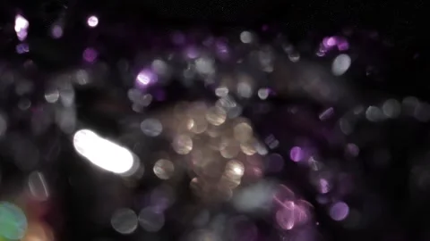 Video of a subtle bokeh spot with multi-colored lights in the dark 스톡 동영상 318074543