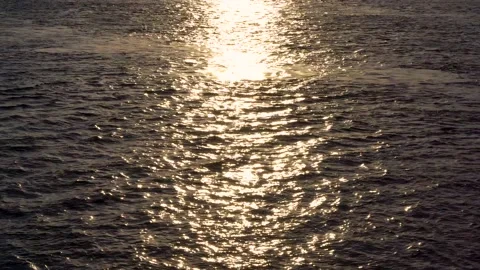 Video of sun glare in the river or sea at sunset Stock Footage 130257986