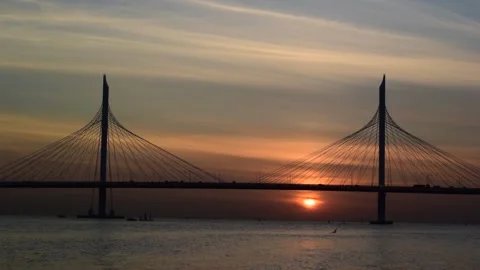 Video of the sunset against the background of the cable-stayed bridge Stock Footage 158060312
