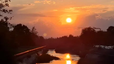Video of sunset and a river. In Baia Mare city, Romania. 4K Stock Footage 284971985