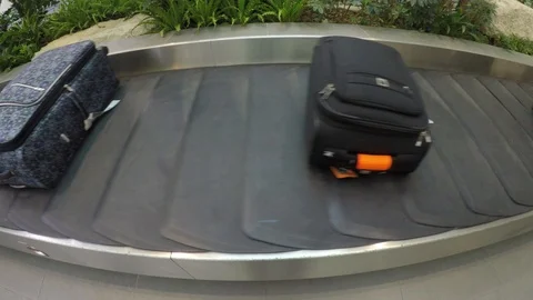 Video super wide angle view of luggage suitcase on the conveyo Stock Footage 95079062