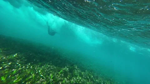 Video of surfer on a blue wave at cloudy day Stock Footage 311001613