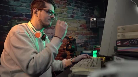 Video Surveillance Guy From 1990s Working on Desktop Computer and Smoking Stock-Footage 303572655